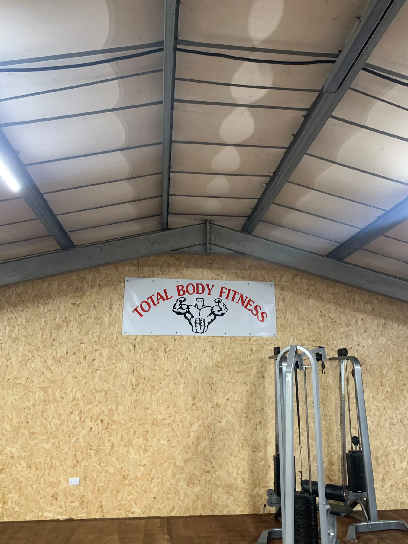 Total Body Fitness banner above the weights area